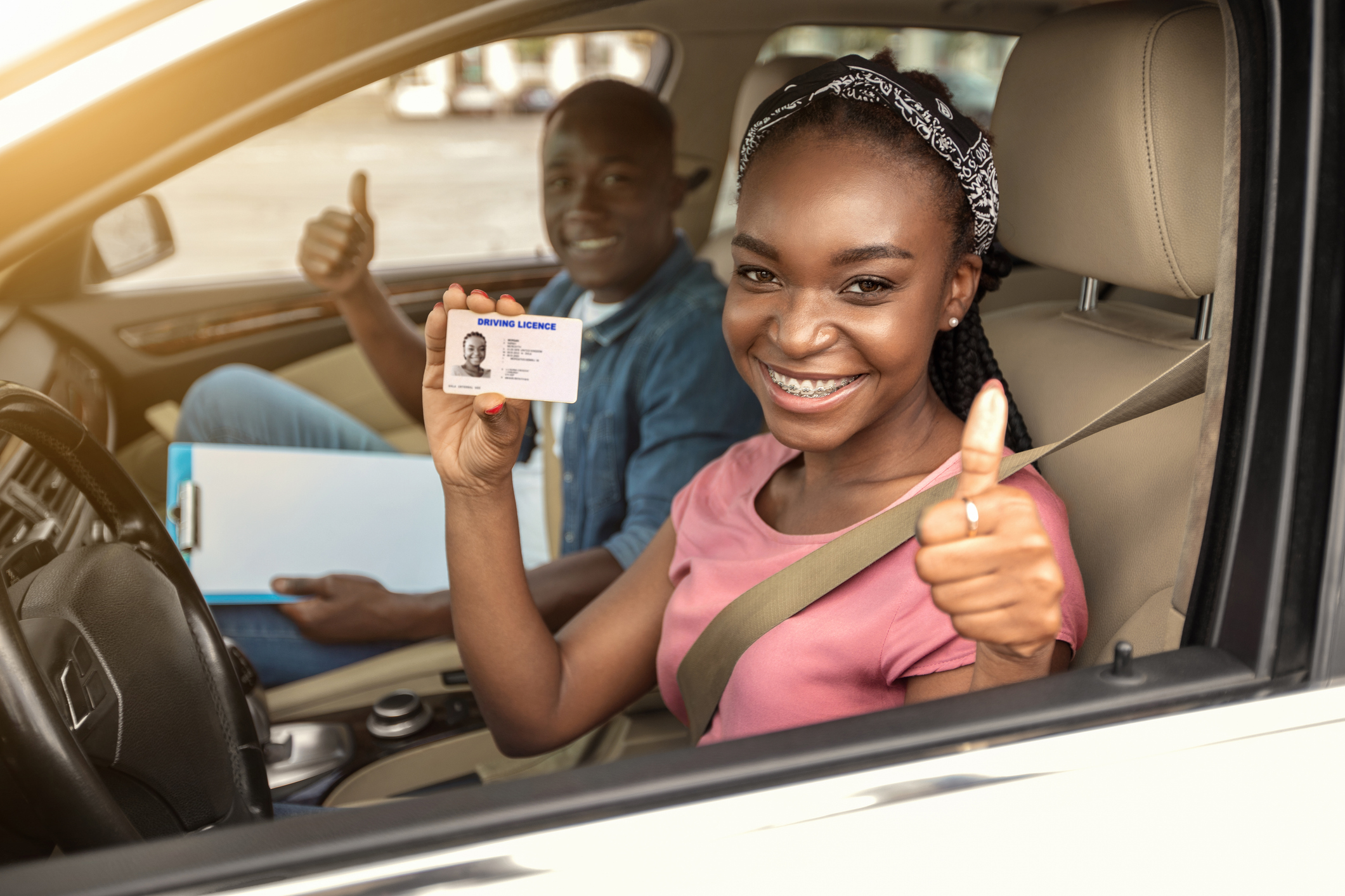 A girl with behind the wheel