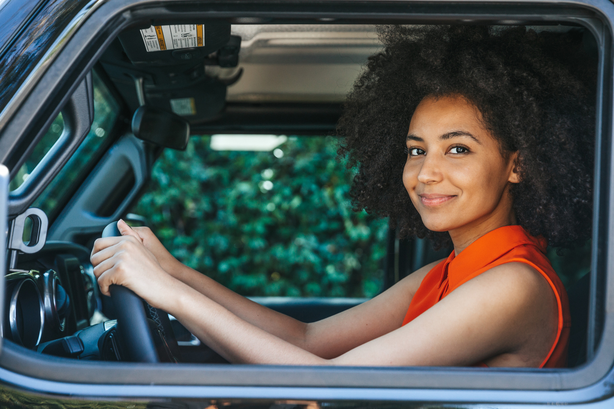 A teen girl behind the wheel